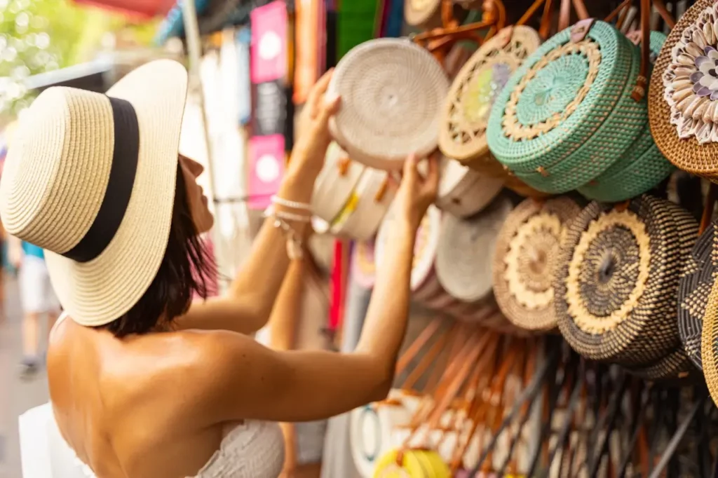 young-lady-buying-wicker-bag-outdoors-in bali